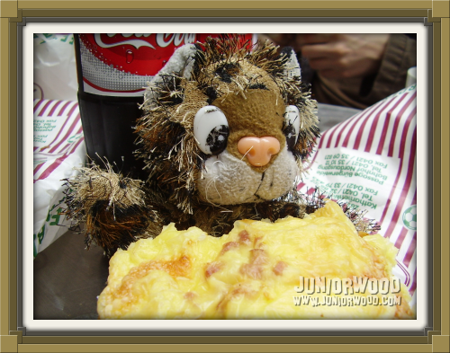 Junior enjoying a cheese bun at Werder-Bäcker-Bünger in Bremen