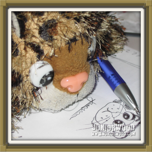 Junior drawing himself with a ballpoint pen.