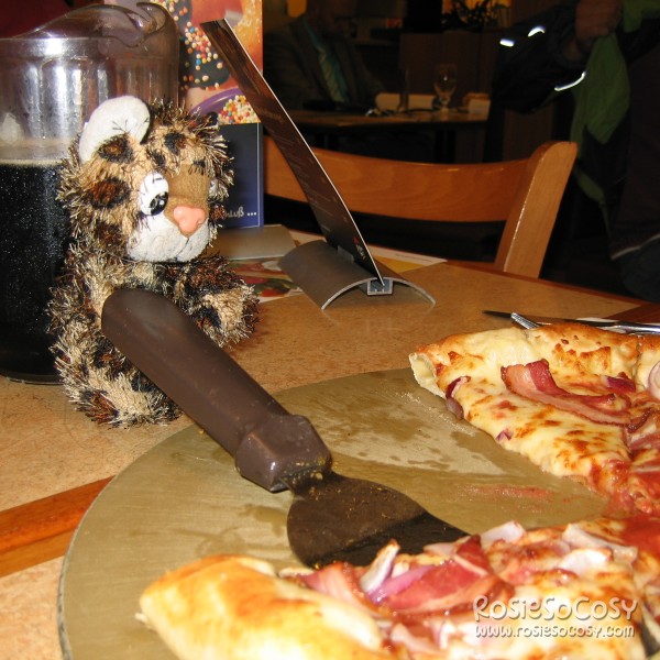 Junior serving pizza