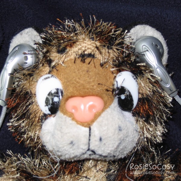 Junior wearing in-ear earplugs to listen to music