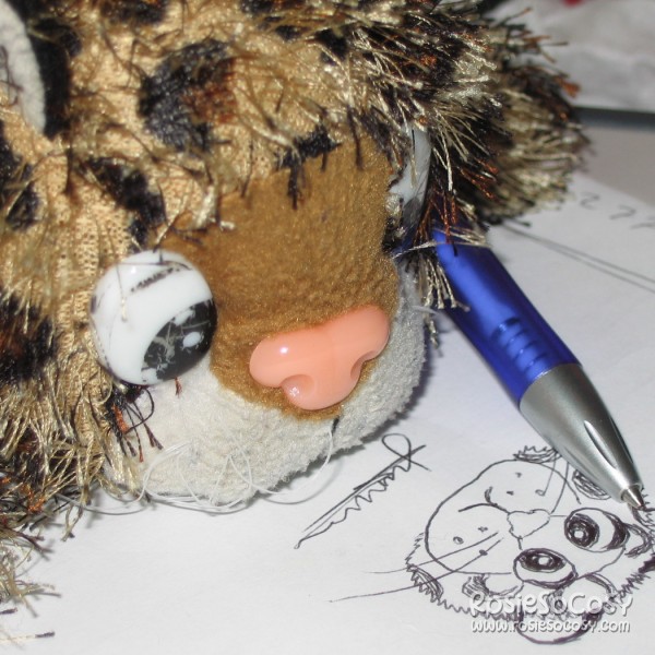 Junior drawing himself with a ballpoint pen.